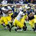 Running back Dennis Norfleet evades being tackled during the Michigan spring football game on Saturday, April 13. AnnArbor.com I Daniel Brenner